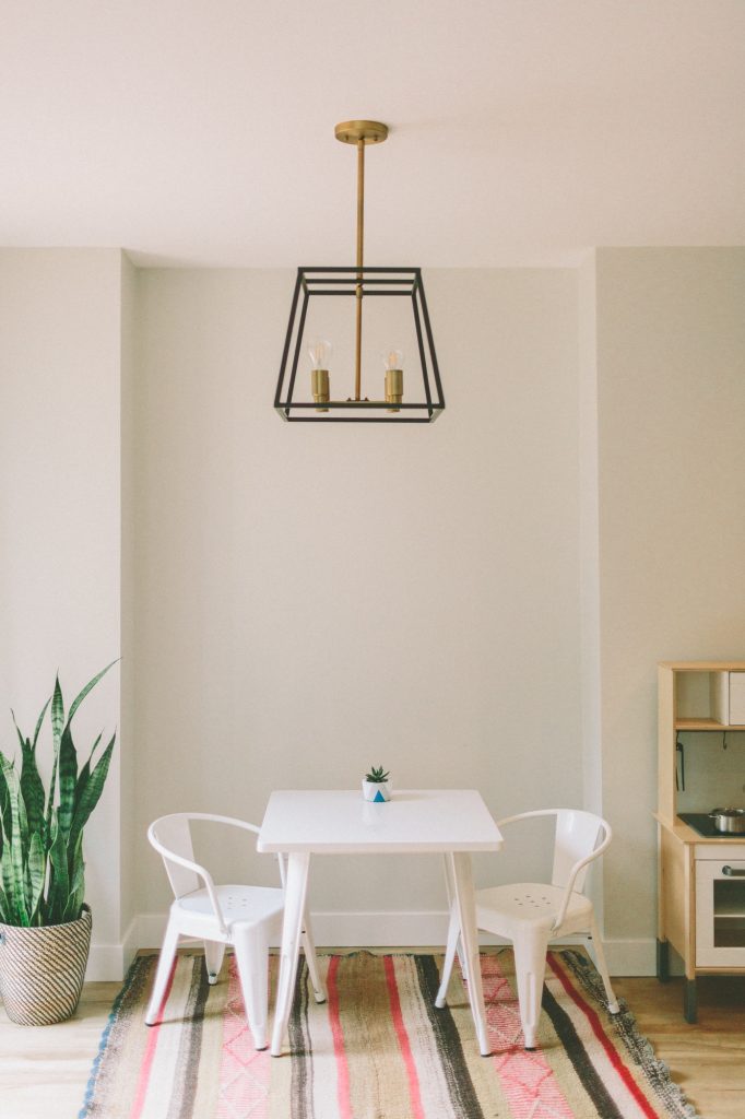 An interior of a small children’s seating area in a bright space.
