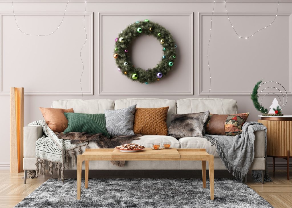 Modern and stylish living room interior with Christmas decorations and sofa. Xmas time at home