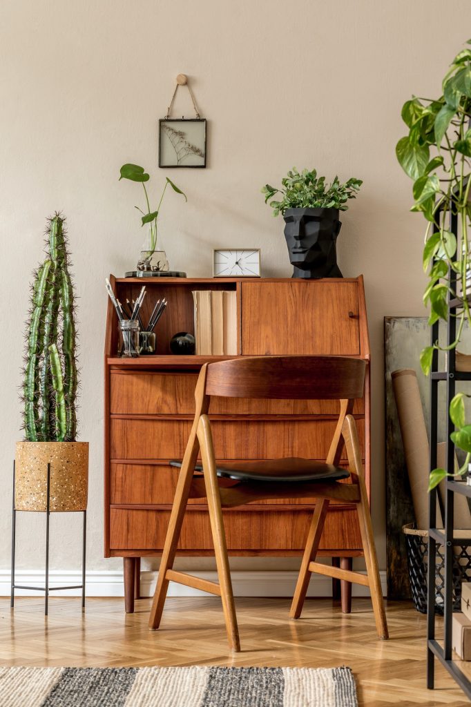 Retro interior design of art workshop room with wooden vintage bureau.