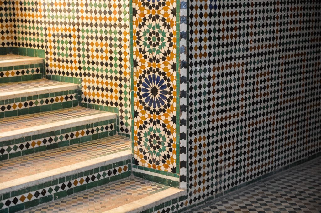 Steps and a wall covered with mosaic tiles
