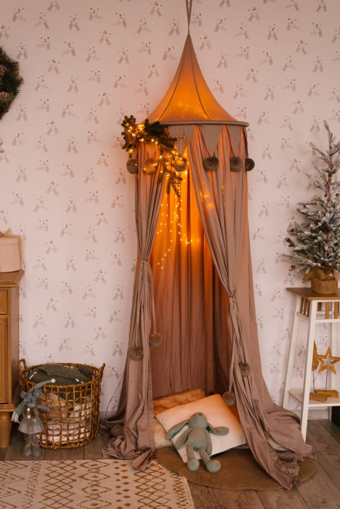 Cozy Tent with Pillows in the Children's Room and a Potted Christmas Tree in the Children's Room
