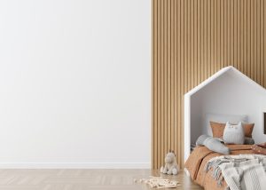 Kids room wallpaper presentation mock up. Empty white wall in modern child room. Copy space